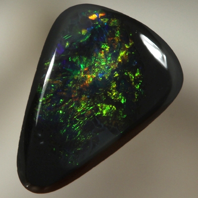 SOLID BLACK OPAL Burning copper orange contrasted by bottle green, always sparkling